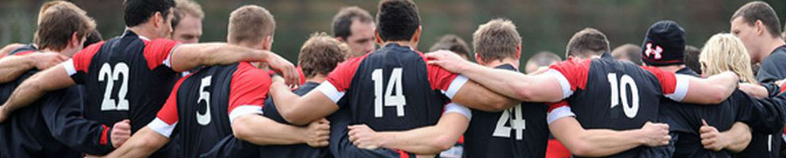 rugby team members hugging